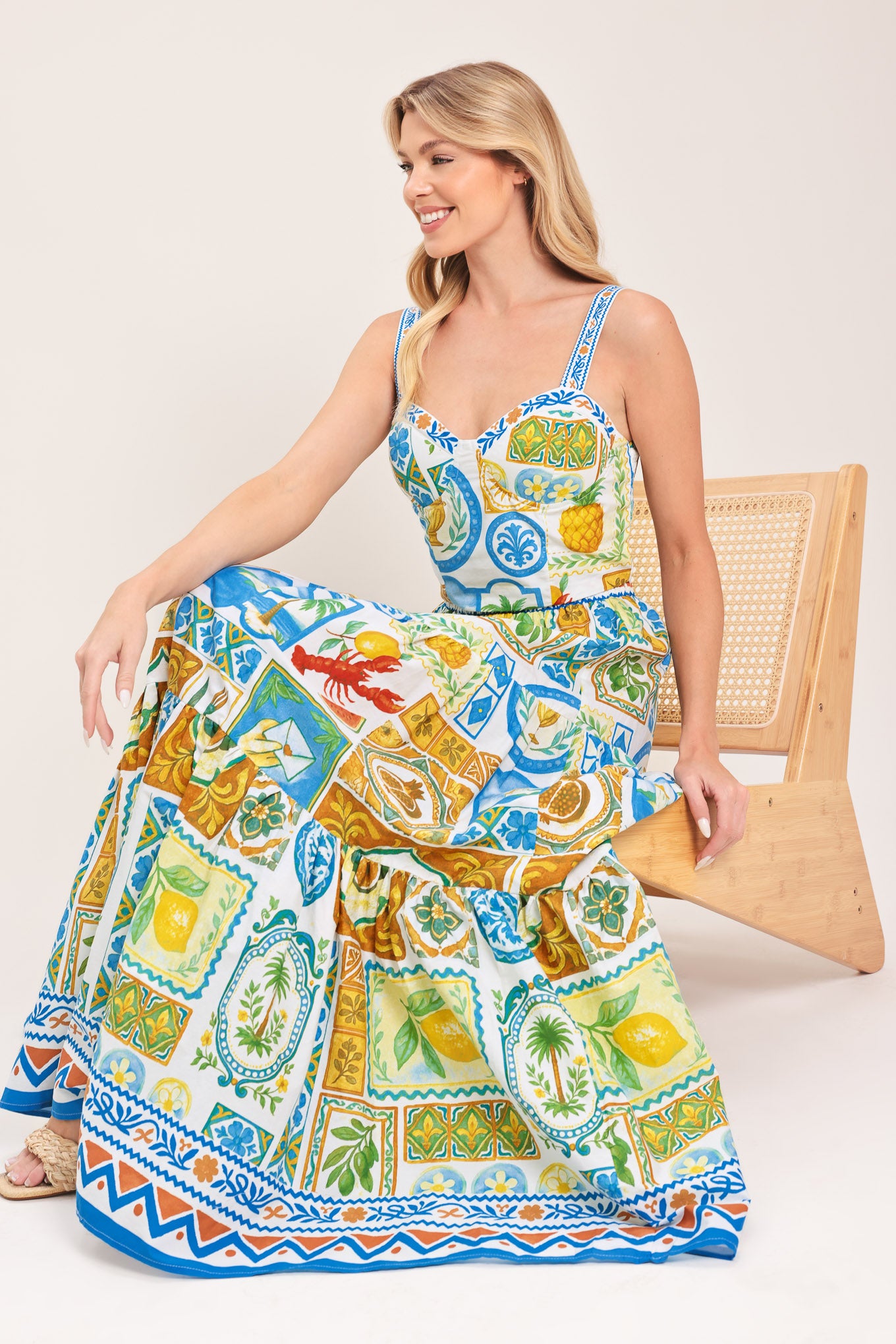 Woman wearing a maxi skirt with elastic waist and tiers featuring a bold, summer print | Flying Tomato