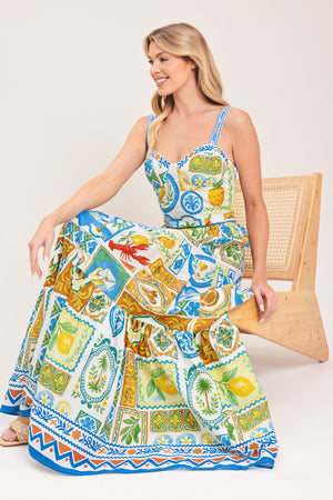 Woman wearing a maxi skirt with elastic waist and tiers featuring a bold, summer print | Flying Tomato