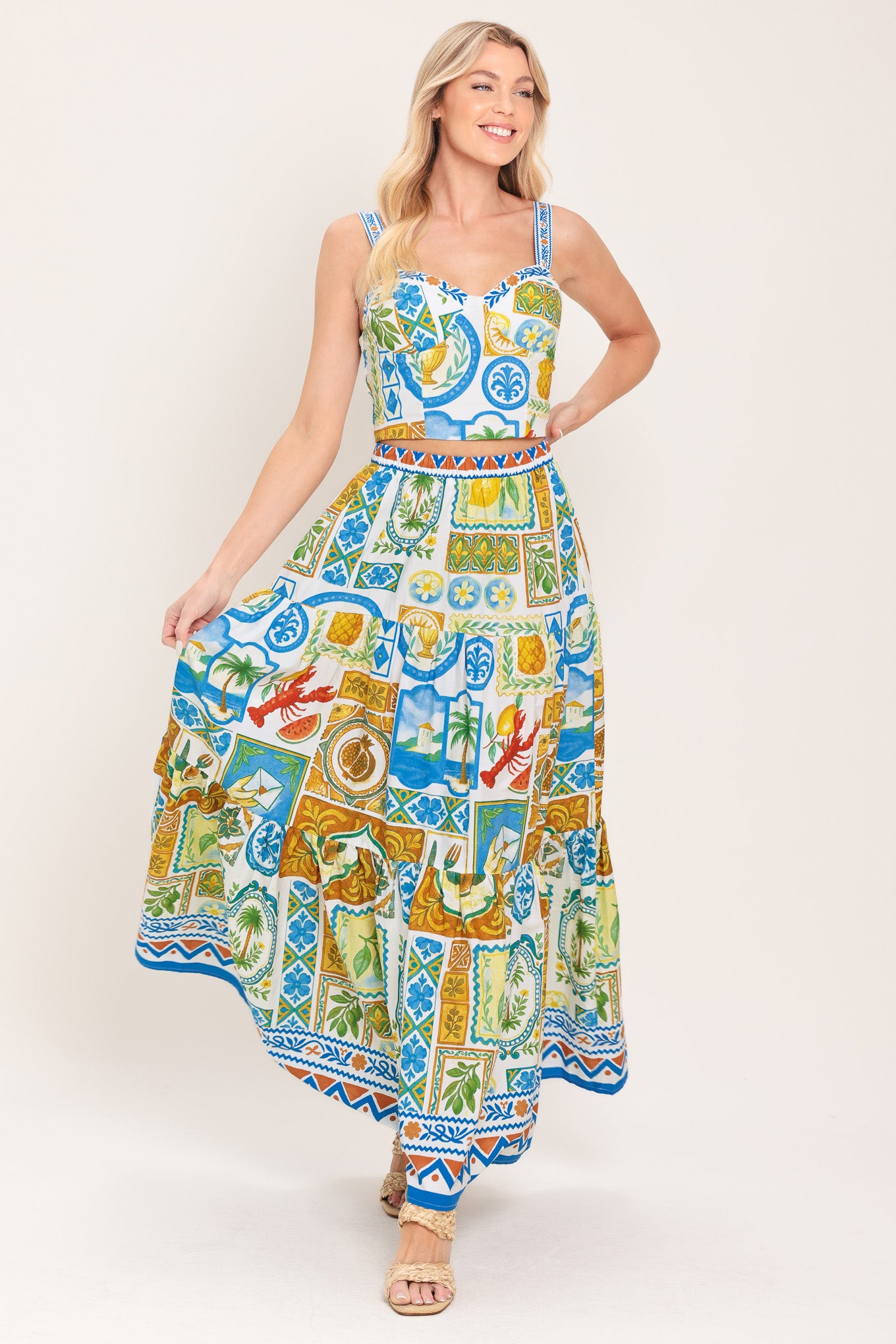 Woman wearing a maxi skirt with elastic waist and tiers featuring a bold, summer print | Flying Tomato
