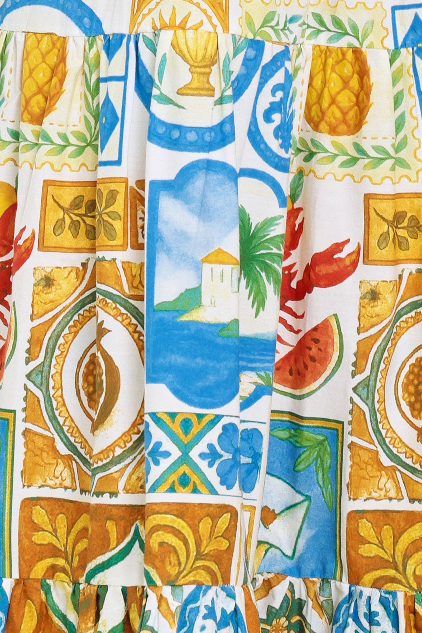 Close up of a bold summer print featuring a lobster, watermelon, and other blue and gold details | Flying Tomato