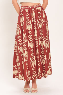 Woman wearing a burgundy ankle skirt with beige floral pattern | Flying Tomato