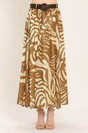 Woman wearing a mocha and taupe zebra print midi skirt with a belt | Flying Tomato