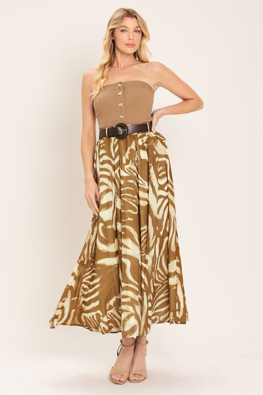 Woman wearing a mocha and taupe zebra print midi skirt with a belt | Flying Tomato