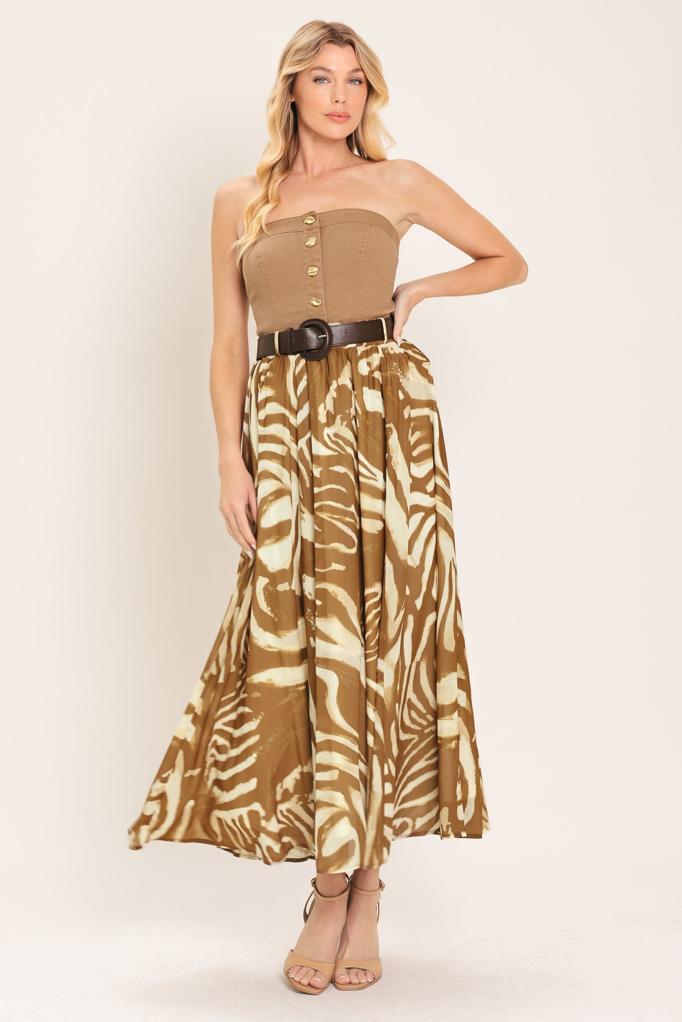 Woman wearing a mocha and taupe zebra print midi skirt with a belt | Flying Tomato