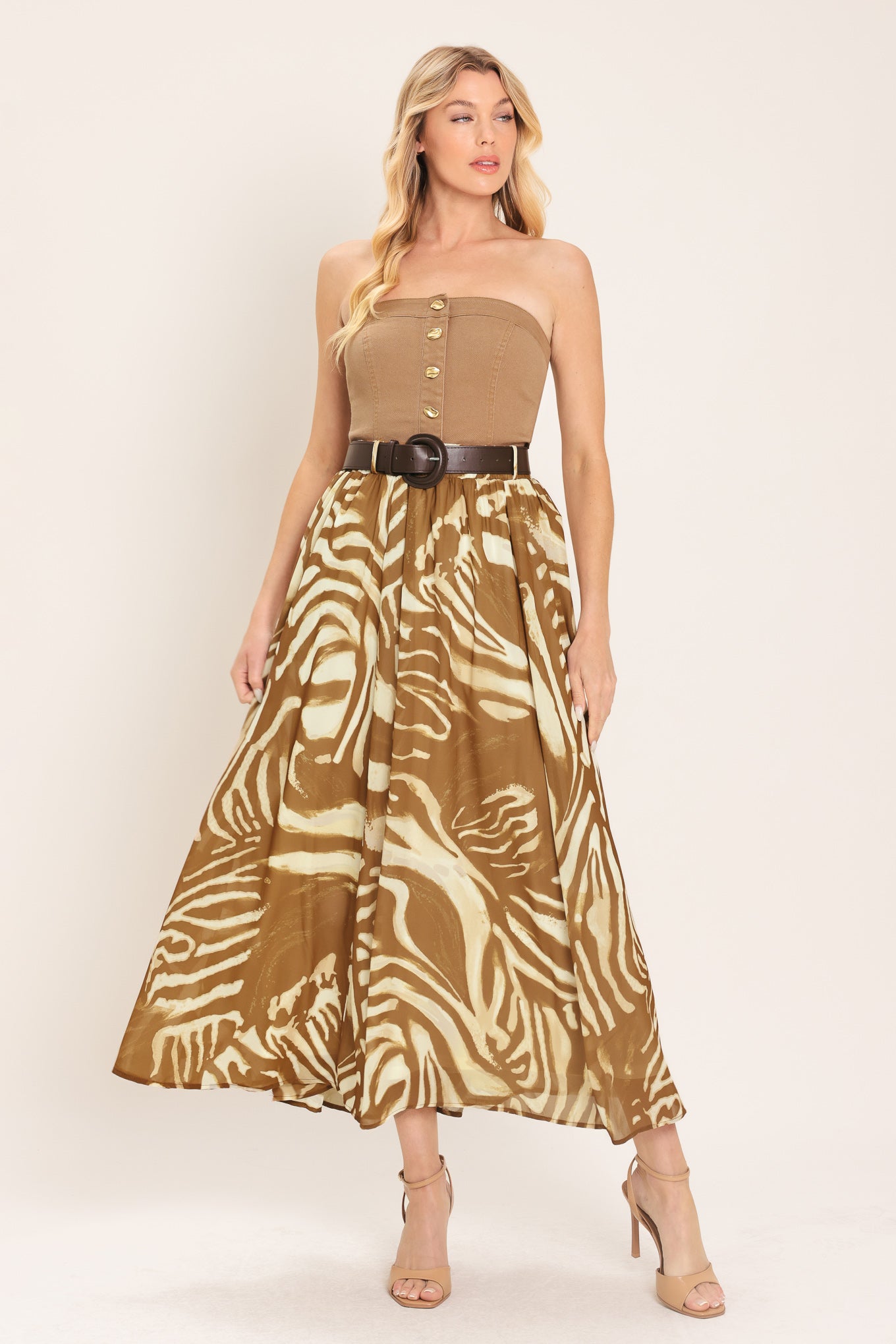 Woman wearing a mocha and taupe zebra print midi skirt with a belt | Flying Tomato