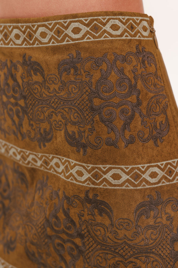 A camel mini skirt with a dark brown damask pattern and cream geometric borders | Flying Tomato