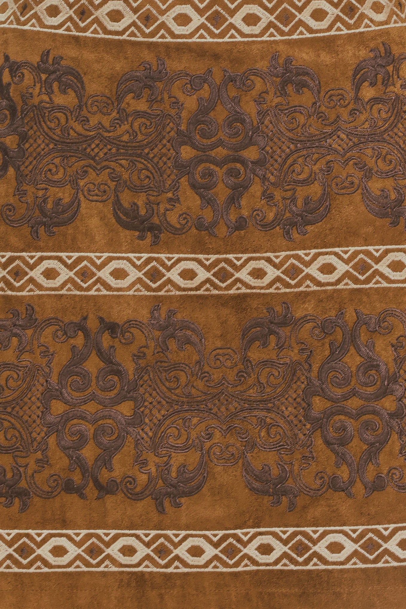 A camel mini skirt with a dark brown damask pattern and cream geometric borders | Flying Tomato
