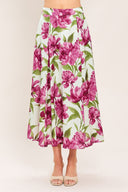 A high-waisted, A-line midi skirt with a vibrant pink and green floral print on a white background | Flying Tomato