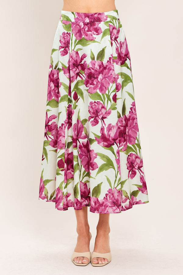 A high-waisted, A-line midi skirt with a vibrant pink and green floral print on a white background | Flying Tomato