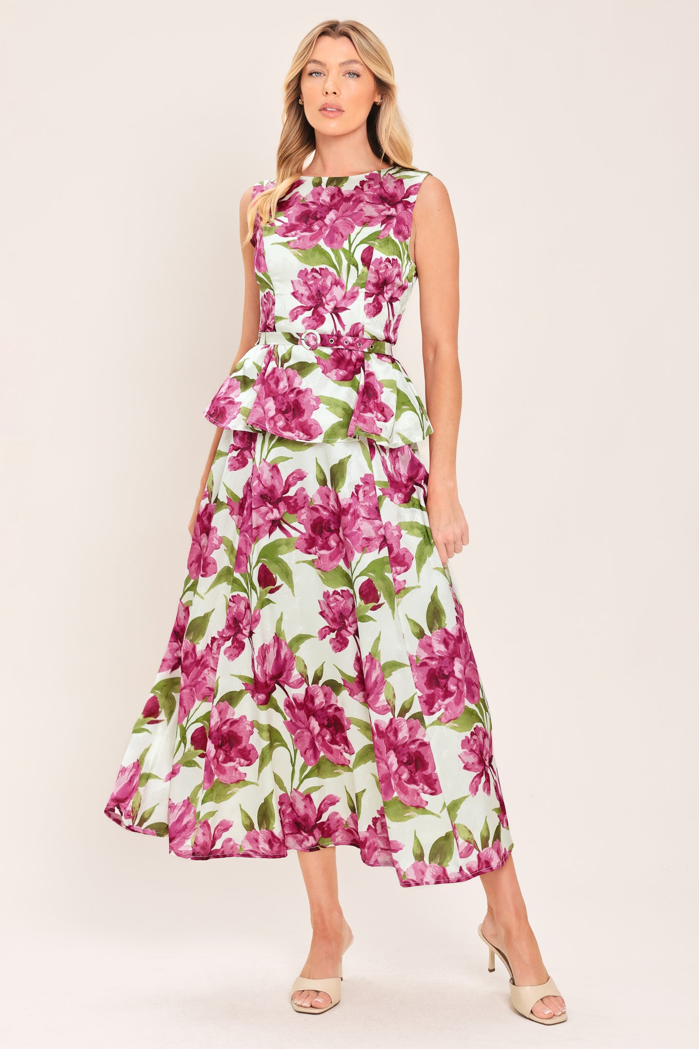 A high-waisted, A-line midi skirt with a vibrant pink and green floral print on a white background | Flying Tomato