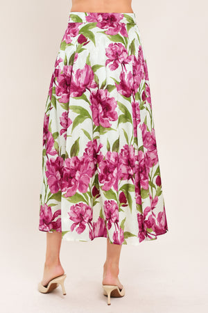 A high-waisted, A-line midi skirt with a vibrant pink and green floral print on a white background | Flying Tomato