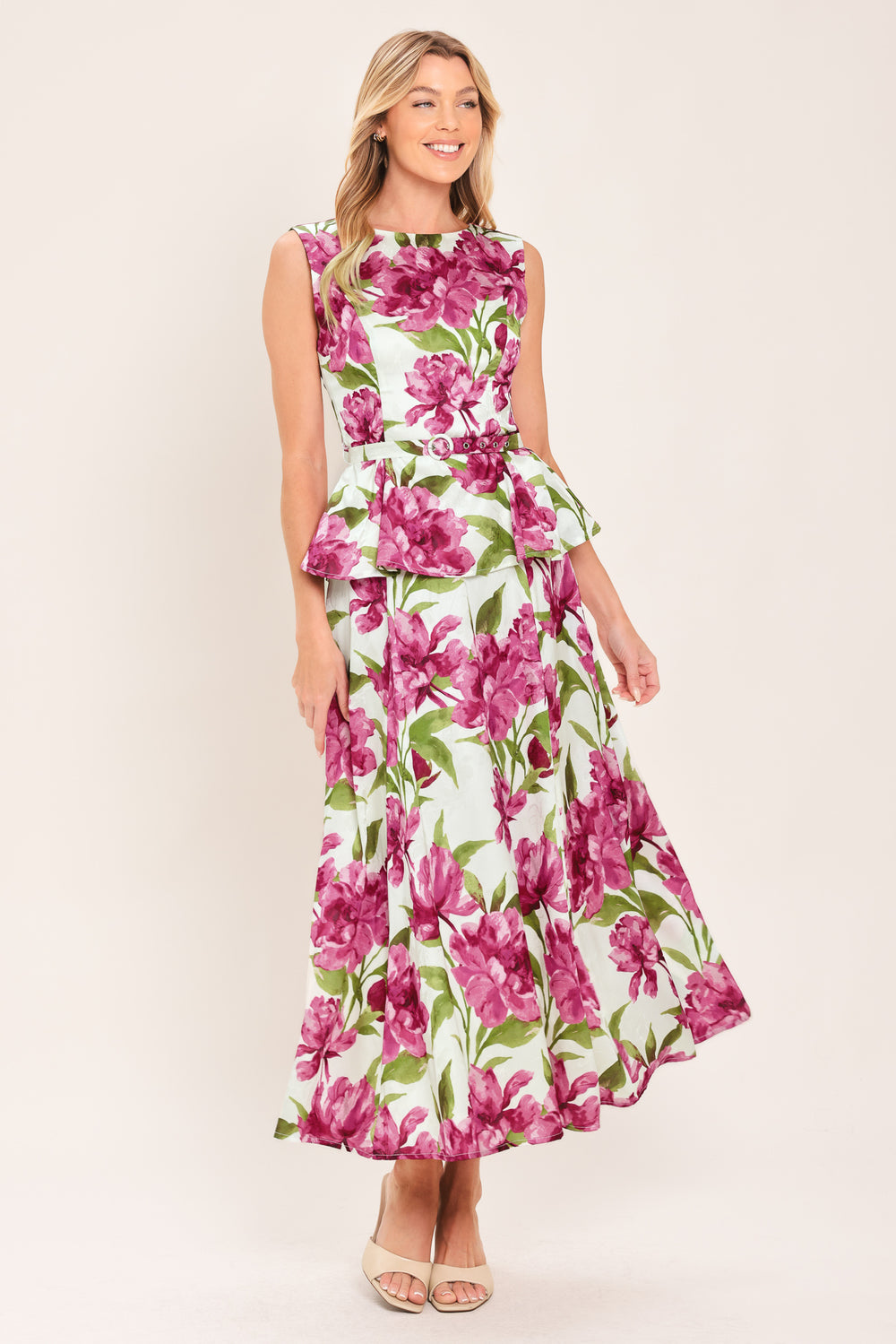 A high-waisted, A-line midi skirt with a vibrant pink and green floral print on a white background | Flying Tomato
