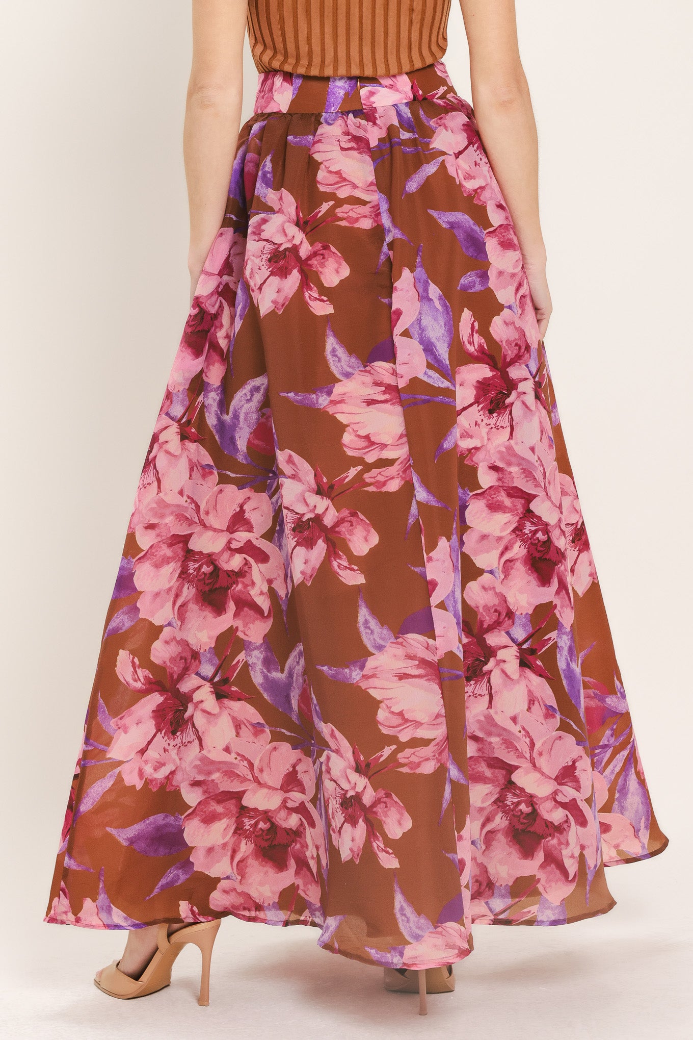 Woman wearing a brown floral maxi skirt with pink and purple flowers | Flying Tomato