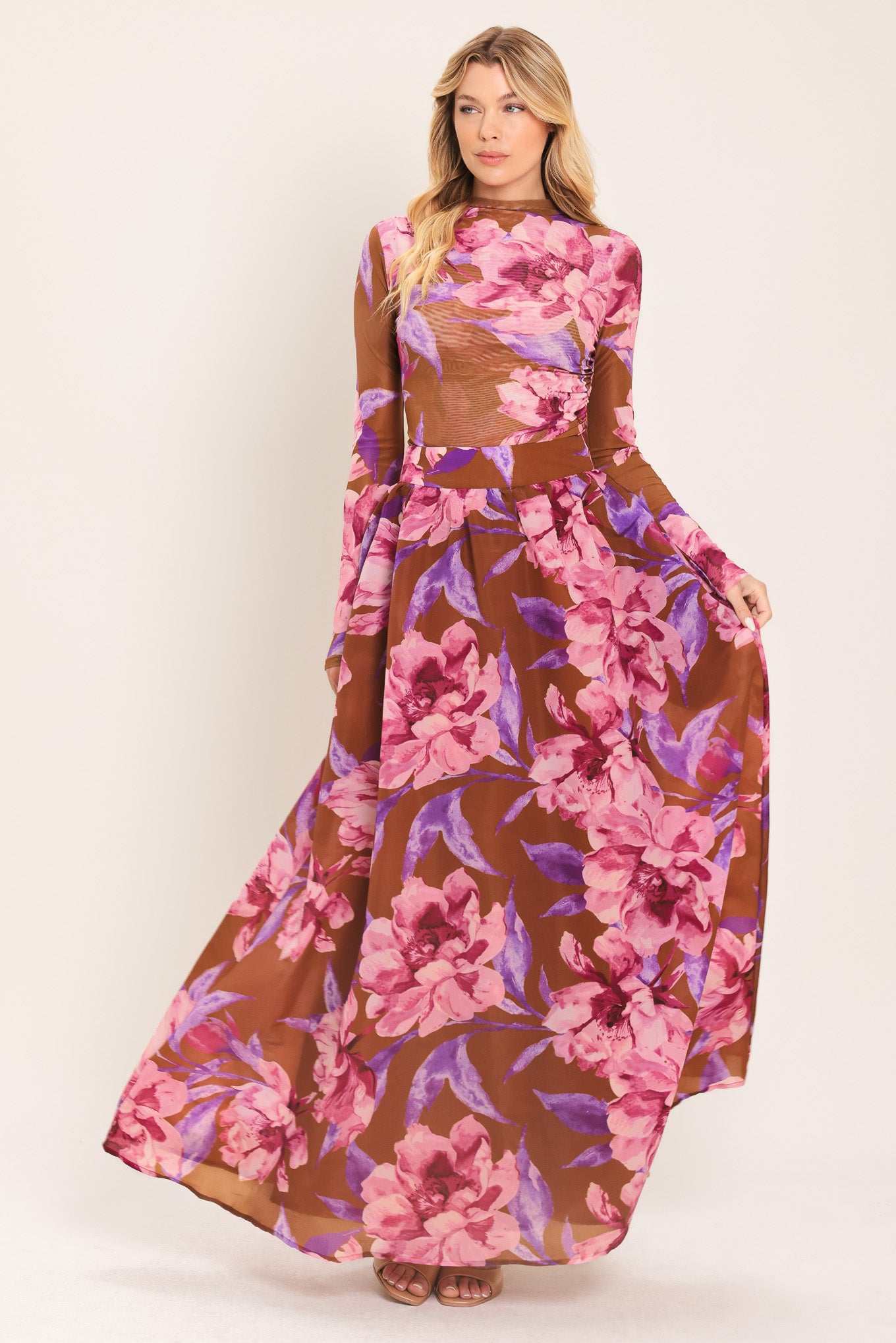 Woman wearing a brown floral maxi skirt with pink and purple flowers | Flying Tomato