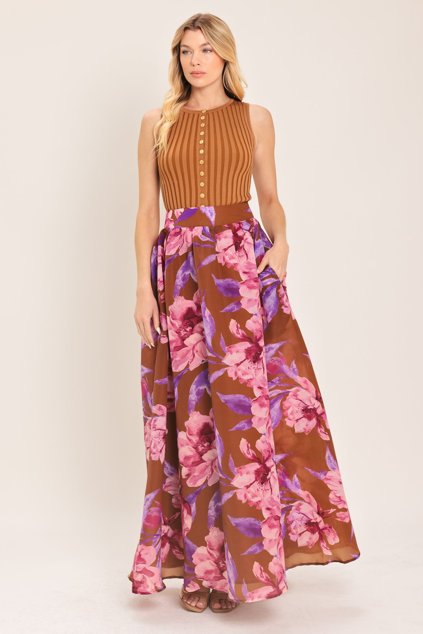 Woman wearing a brown floral maxi skirt with pink and purple flowers | Flying Tomato