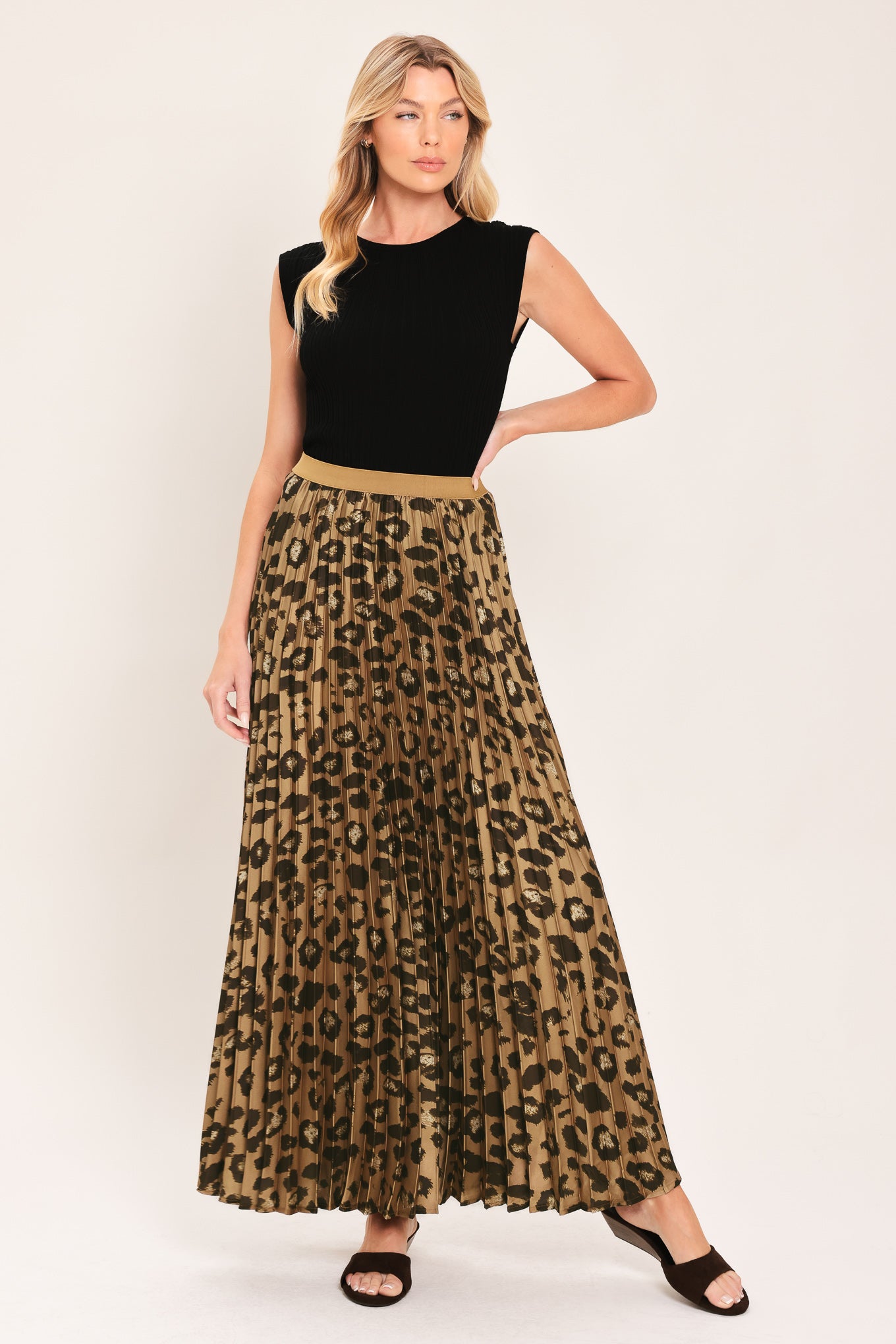 A pleated maxi skirt with a leopard print pattern in brown and black, featuring a solid tan waistband | Flying Tomato