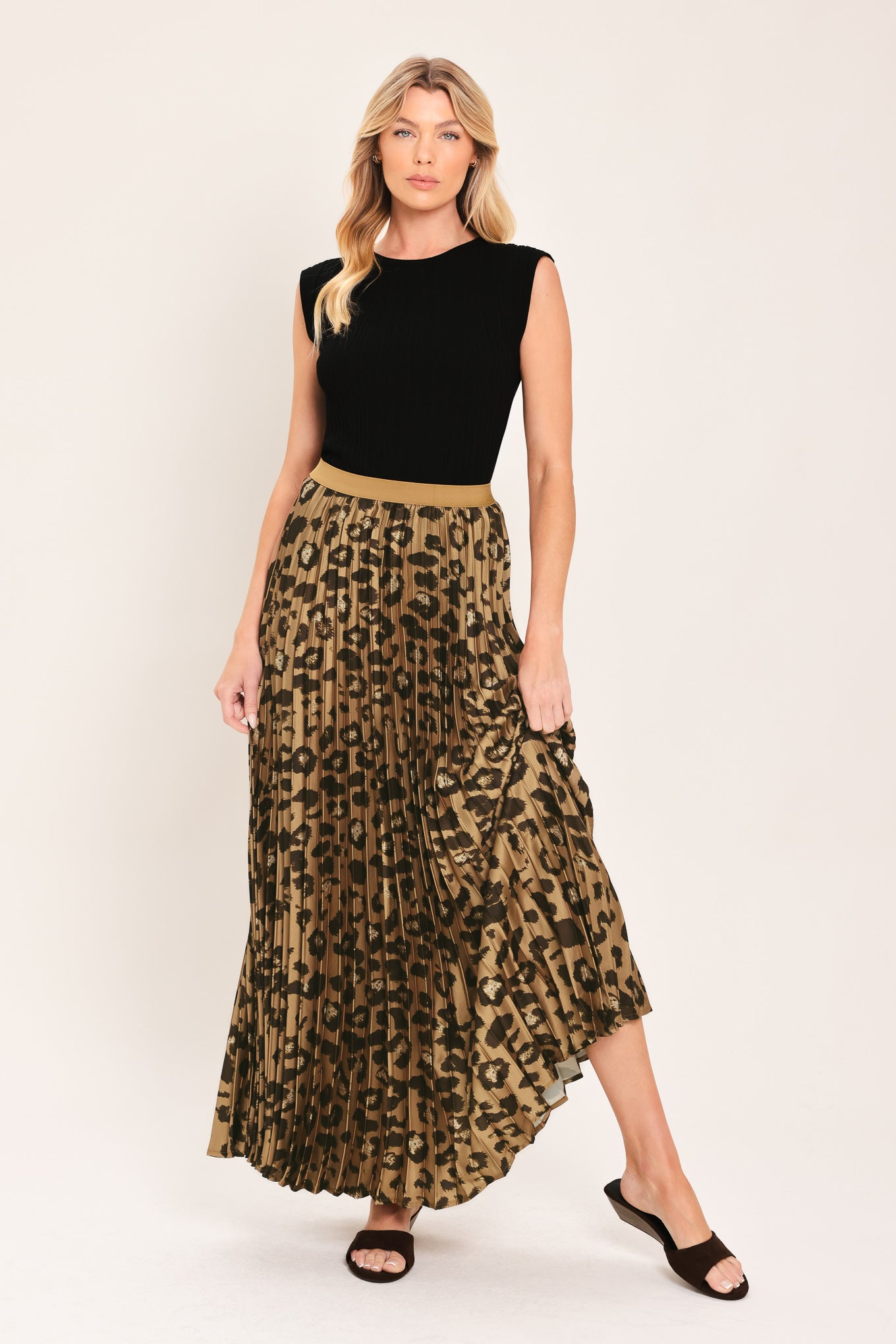 A pleated maxi skirt with a leopard print pattern in brown and black, featuring a solid tan waistband | Flying Tomato