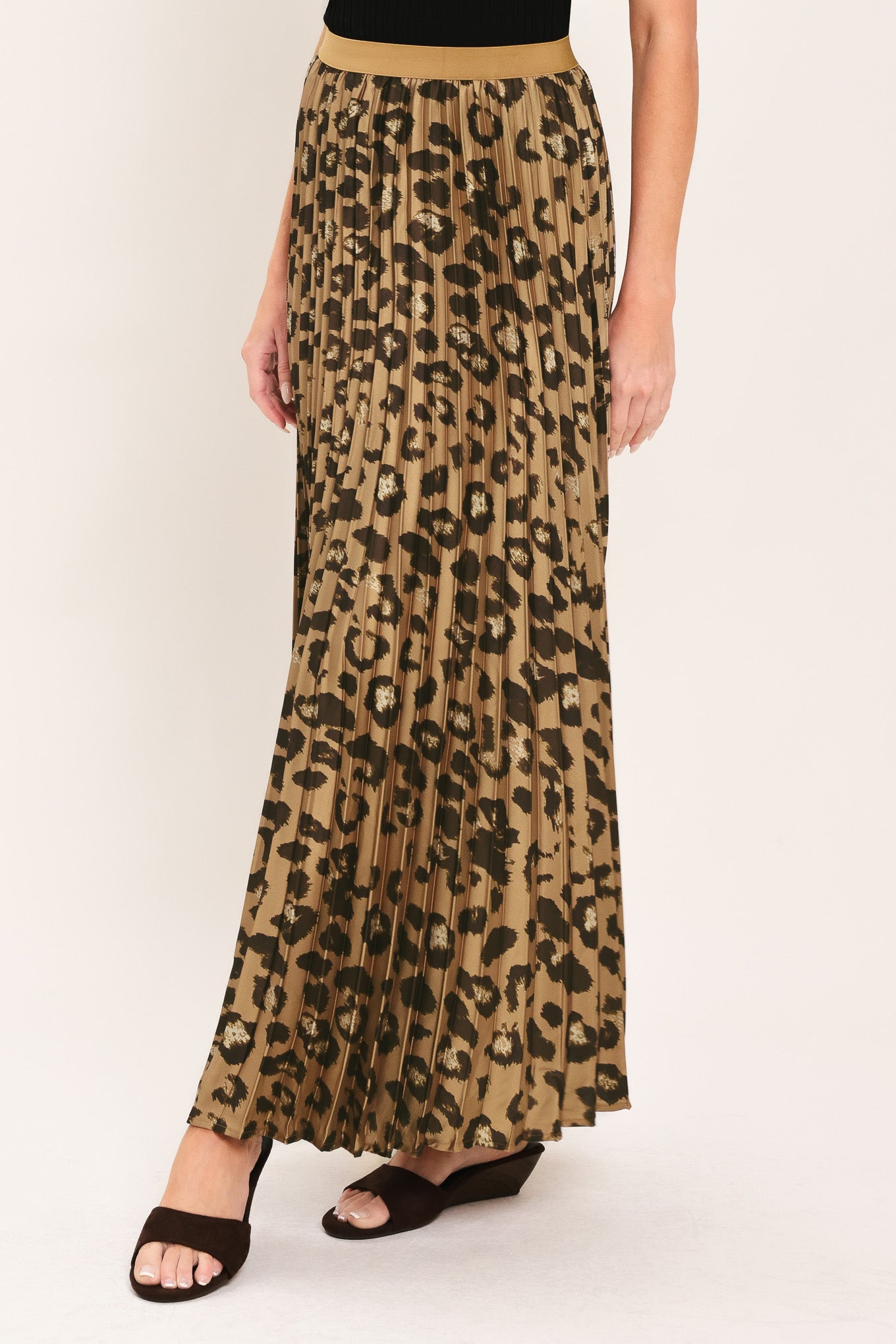 A pleated maxi skirt with a leopard print pattern in brown and black, featuring a solid tan waistband | Flying Tomato