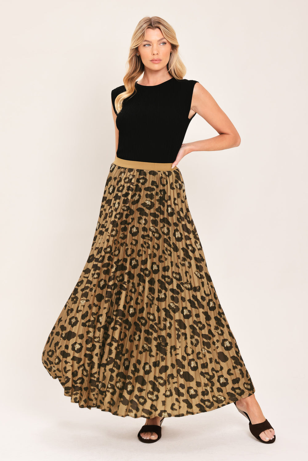 A pleated maxi skirt with a leopard print pattern in brown and black, featuring a solid tan waistband | Flying Tomato