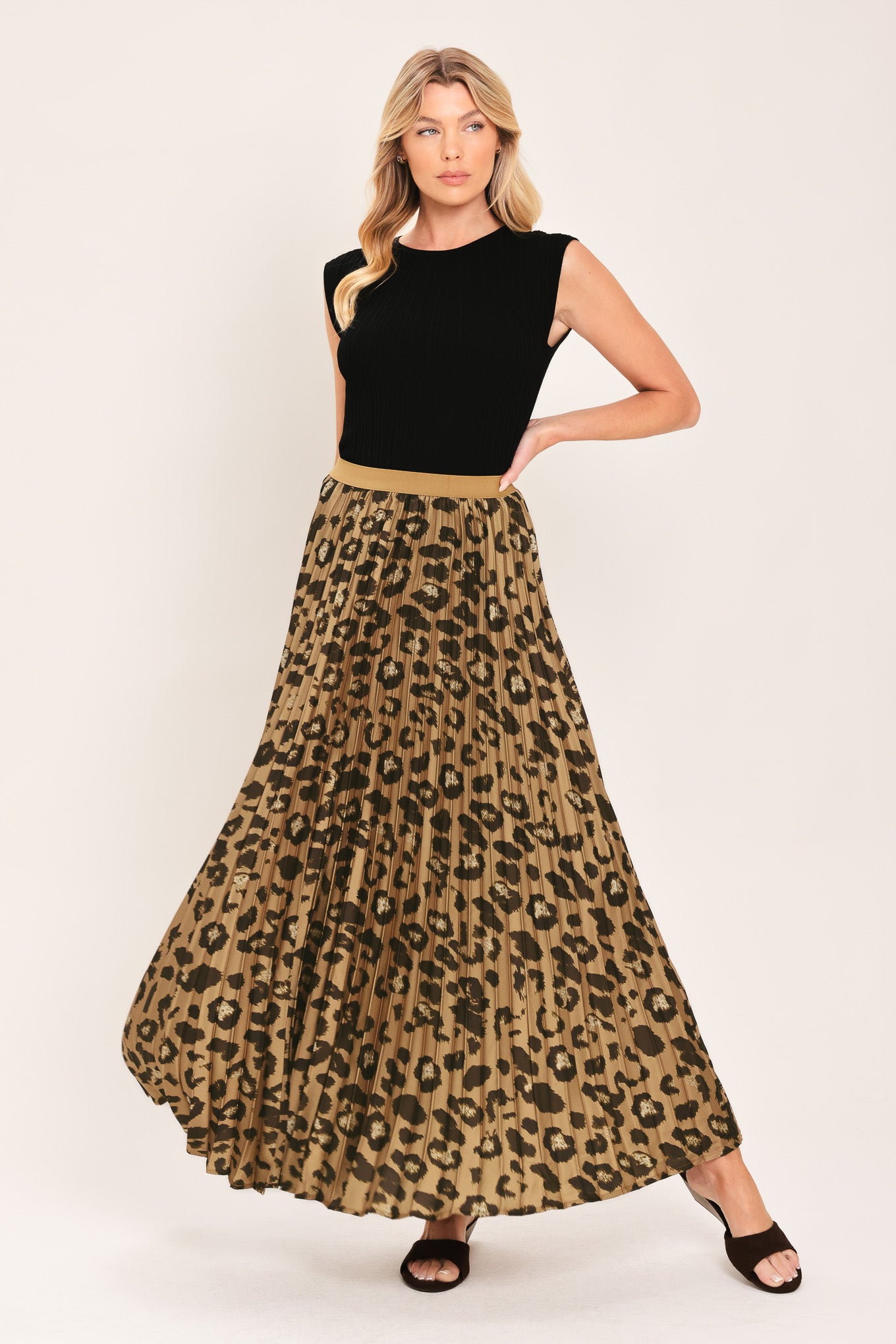 A pleated maxi skirt with a leopard print pattern in brown and black, featuring a solid tan waistband | Flying Tomato