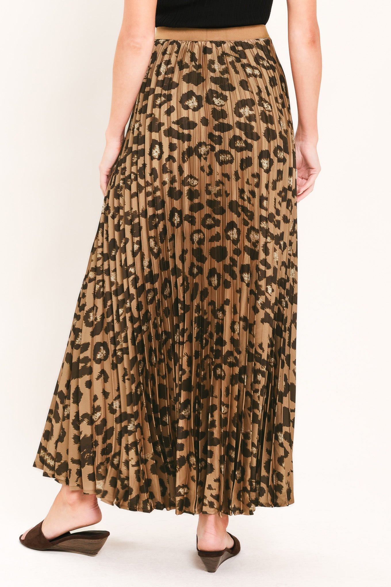 A pleated maxi skirt with a leopard print pattern in brown and black, featuring a solid tan waistband | Flying Tomato