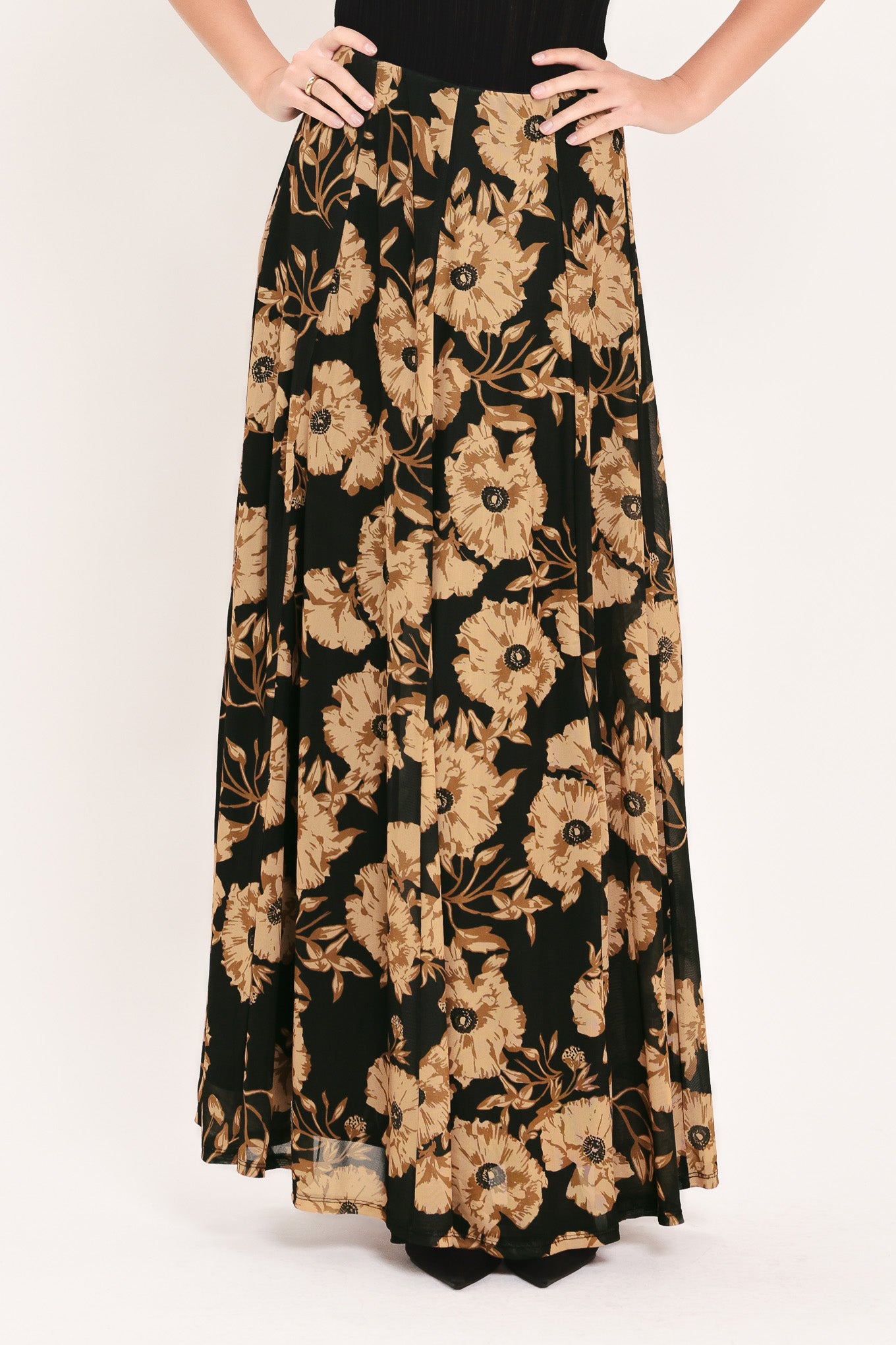 A high-waisted, power mesh maxi skirt with a black base and a large beige floral pattern | Flying Tomato