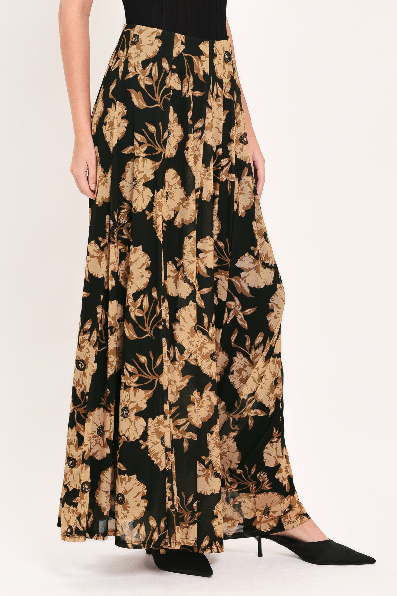 A high-waisted, power mesh maxi skirt with a black base and a large beige floral pattern | Flying Tomato