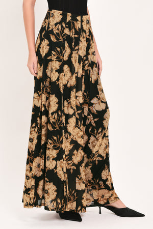 A high-waisted, power mesh maxi skirt with a black base and a large beige floral pattern | Flying Tomato