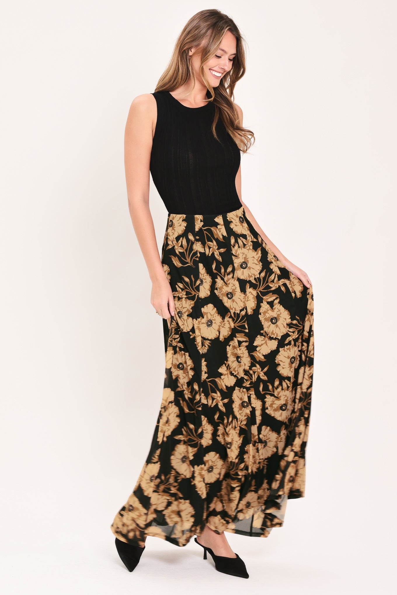A high-waisted, power mesh maxi skirt with a black base and a large beige floral pattern | Flying Tomato