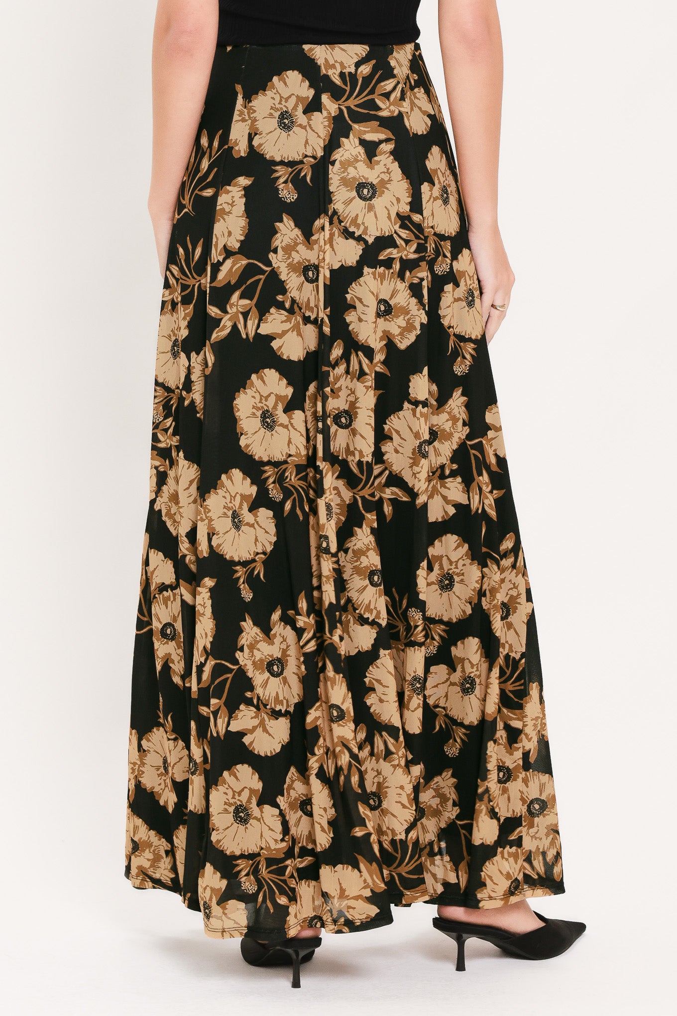 A high-waisted, power mesh maxi skirt with a black base and a large beige floral pattern | Flying Tomato