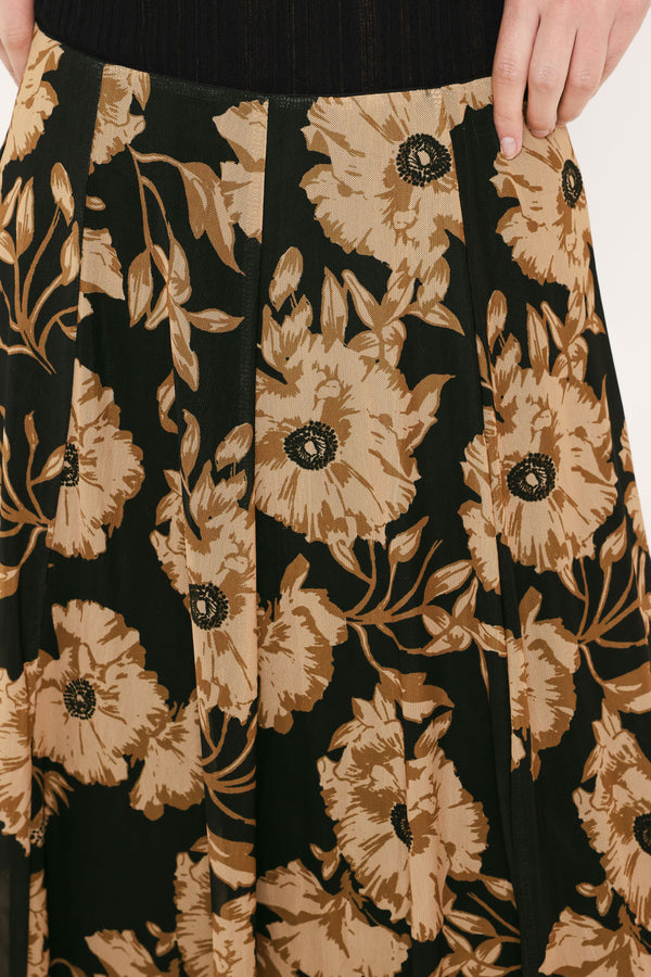 A high-waisted, power mesh maxi skirt with a black base and a large beige floral pattern | Flying Tomato