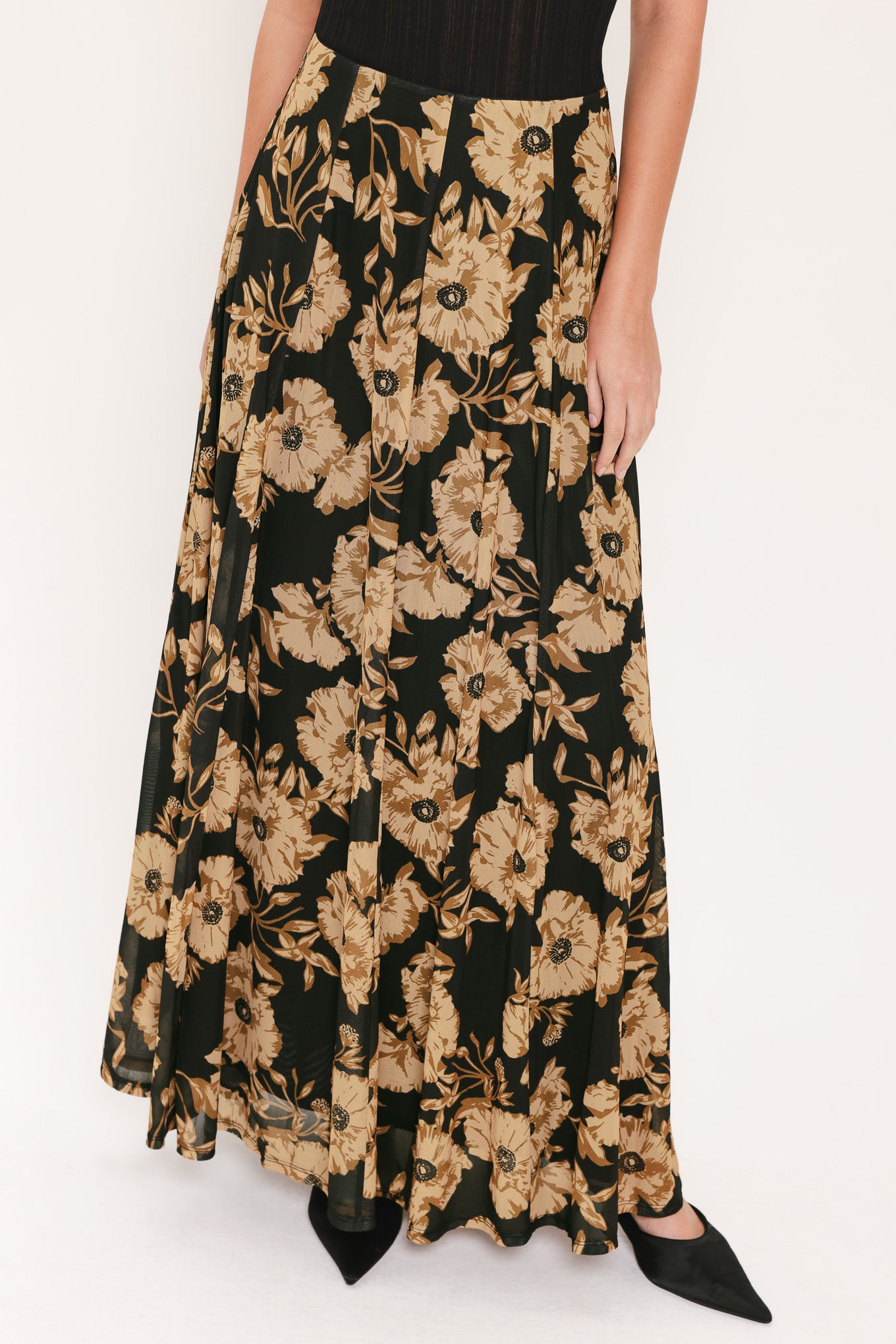 A high-waisted, power mesh maxi skirt with a black base and a large beige floral pattern | Flying Tomato