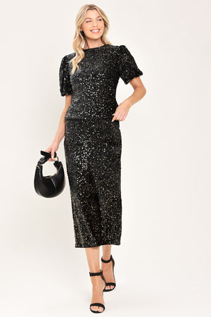 A black sequined midi skirt worn by a model | Flying Tomato
