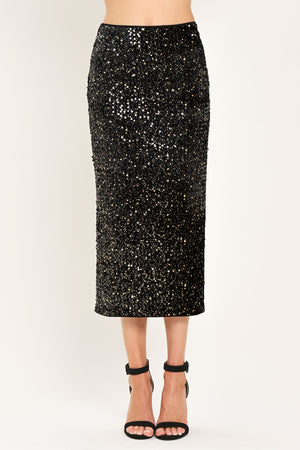 A black sequined midi skirt worn by a model | Flying Tomato