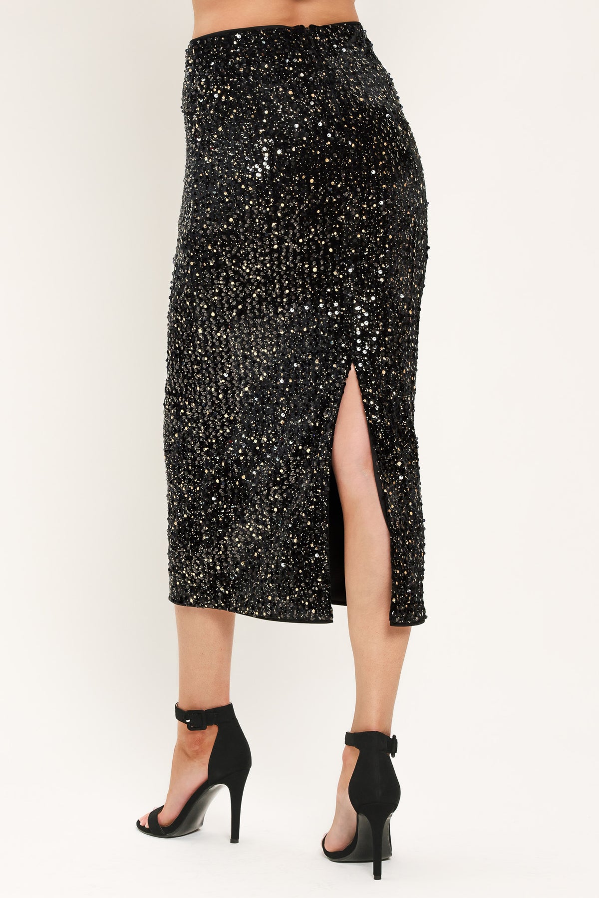 A black sequined midi skirt worn by a model | Flying Tomato