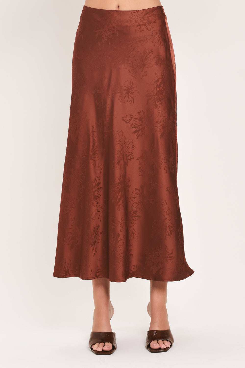 Woman wearing a high waisted jacquard satin midi skirt | Flying Tomato