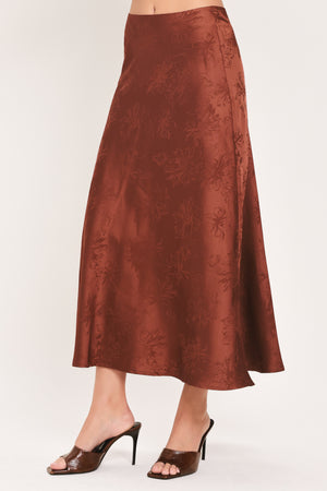 Woman wearing a high waisted jacquard satin midi skirt | Flying Tomato