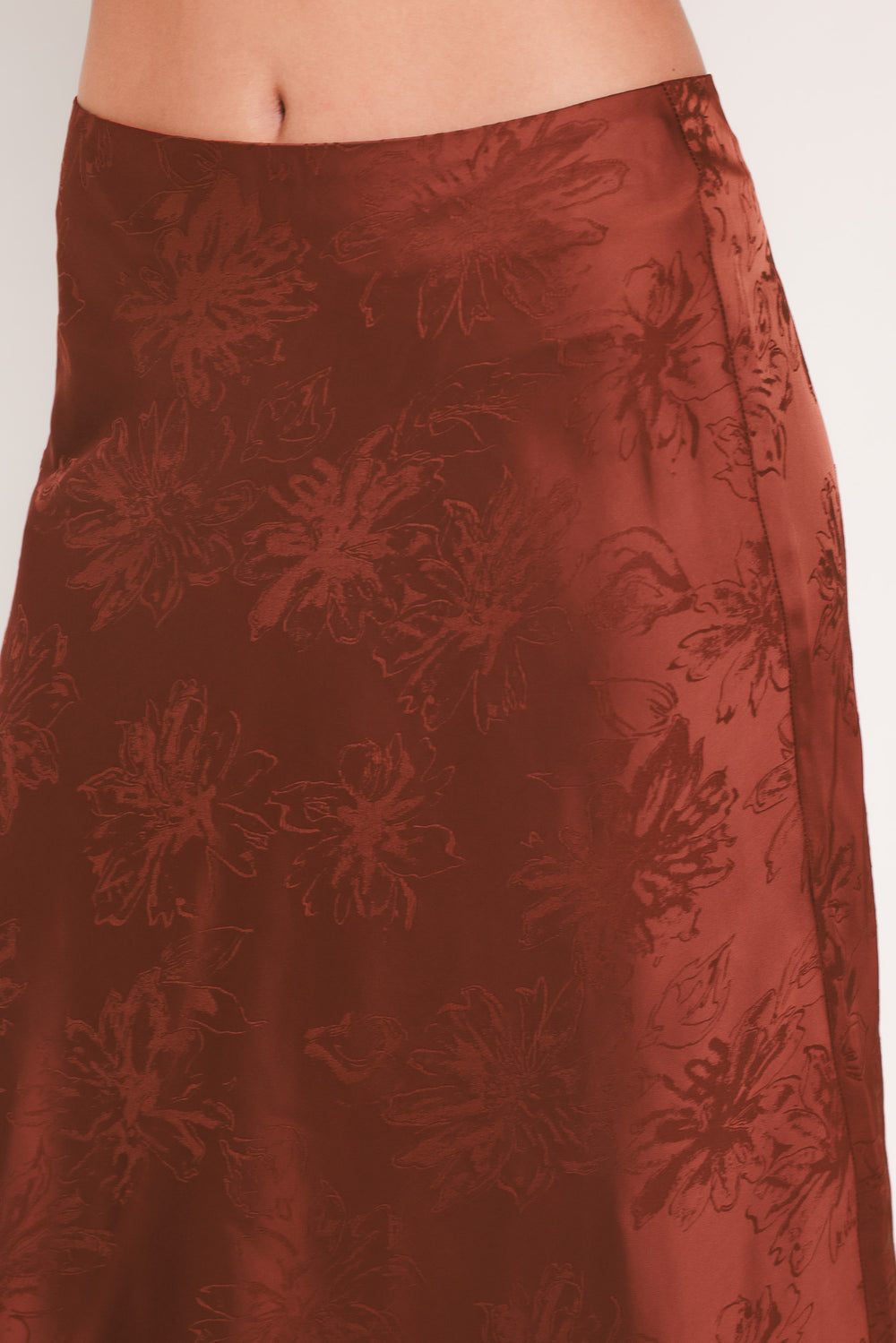 Woman wearing a high waisted jacquard satin midi skirt | Flying Tomato