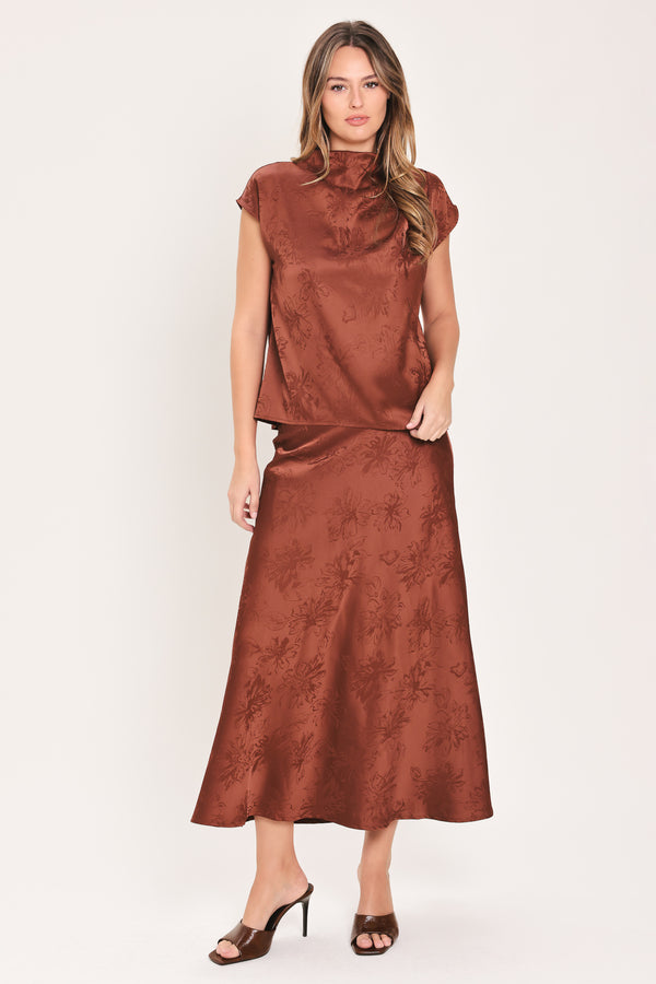 Woman wearing a high waisted jacquard satin midi skirt | Flying Tomato