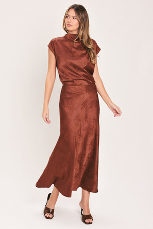 Woman wearing a high waisted jacquard satin midi skirt | Flying Tomato