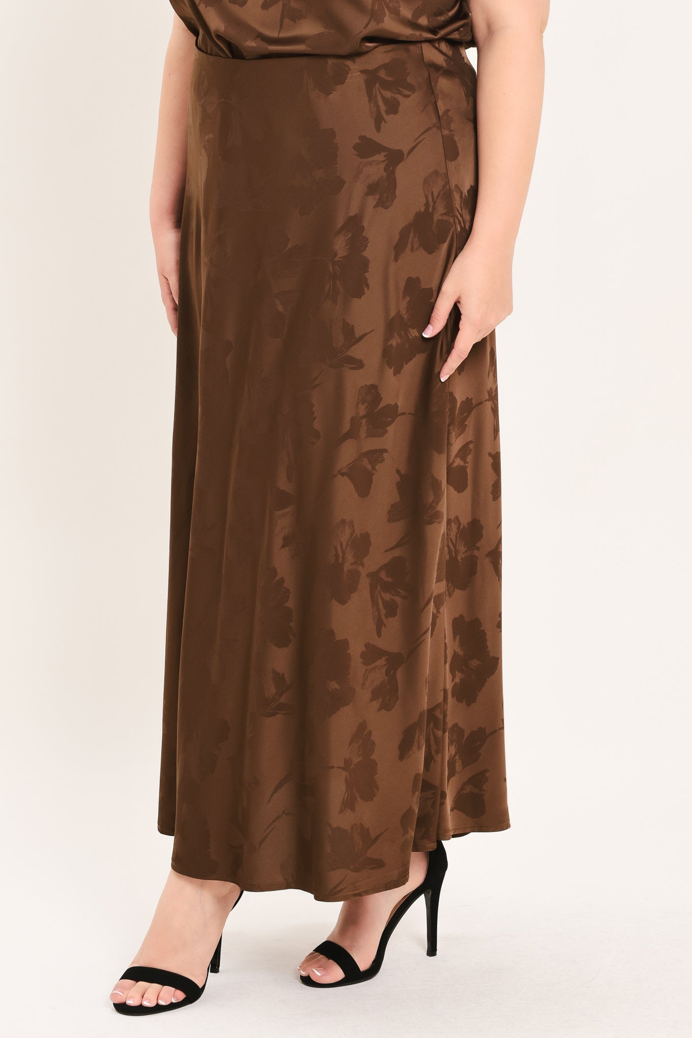 Woman wearing a brown woven jacquard midi skirt with back zipper closure | Plus Curve Flying Tomato