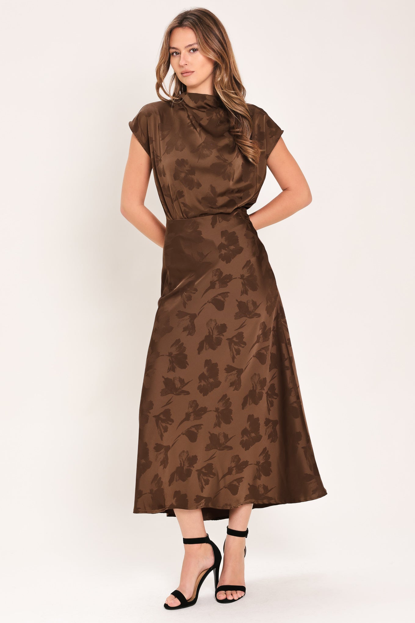 Woman wearing a brown woven jacquard midi skirt with back zipper closure | Flying Tomato