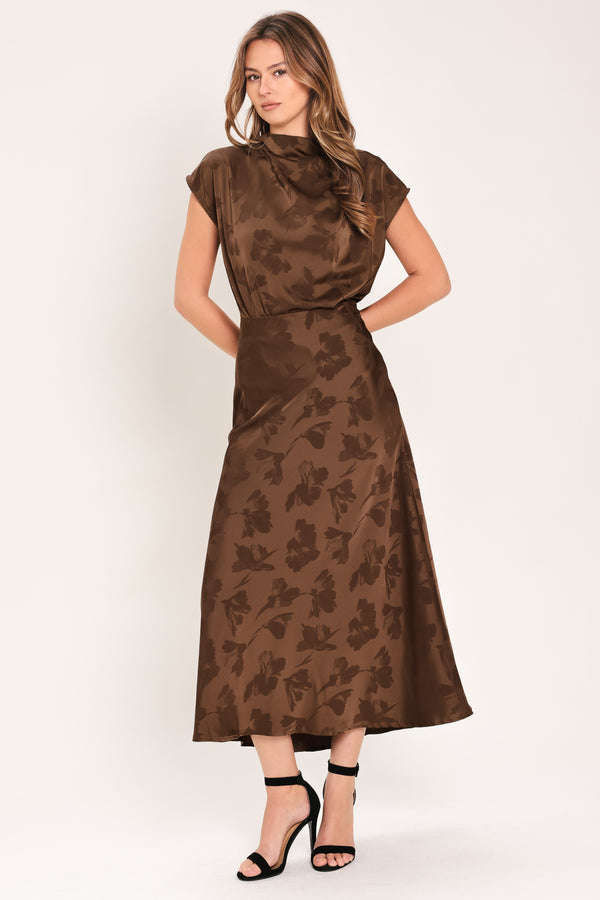 Woman wearing a brown woven jacquard midi skirt with back zipper closure | Flying Tomato