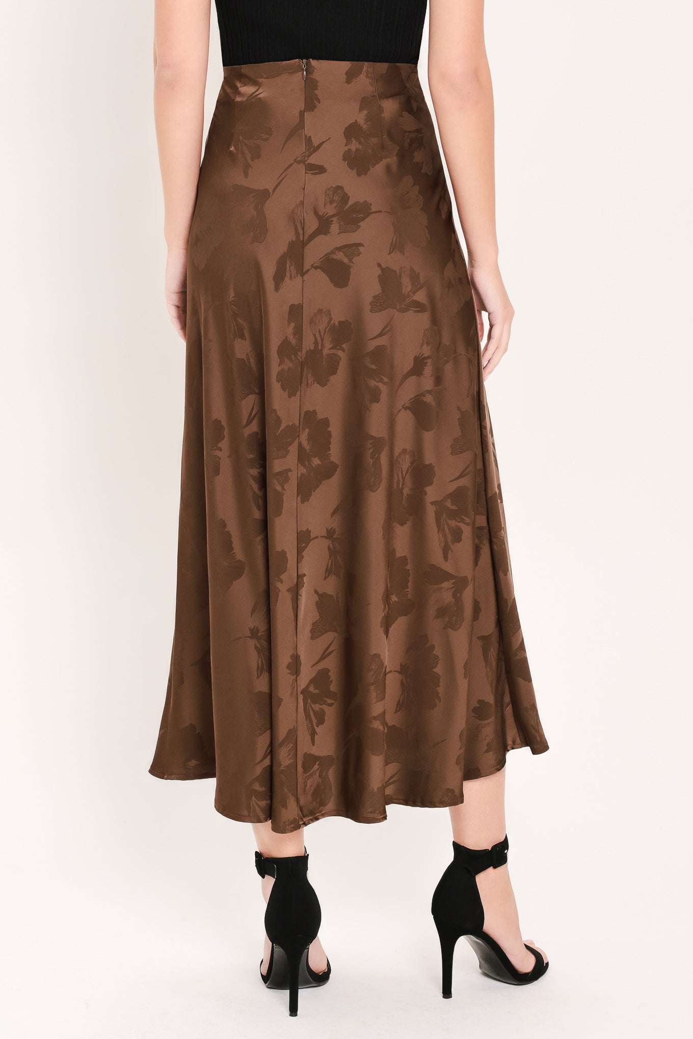Woman wearing a brown woven jacquard midi skirt with back zipper closure | Flying Tomato