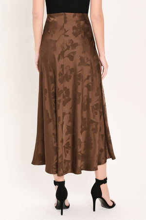 Woman wearing a brown woven jacquard midi skirt with back zipper closure | Flying Tomato
