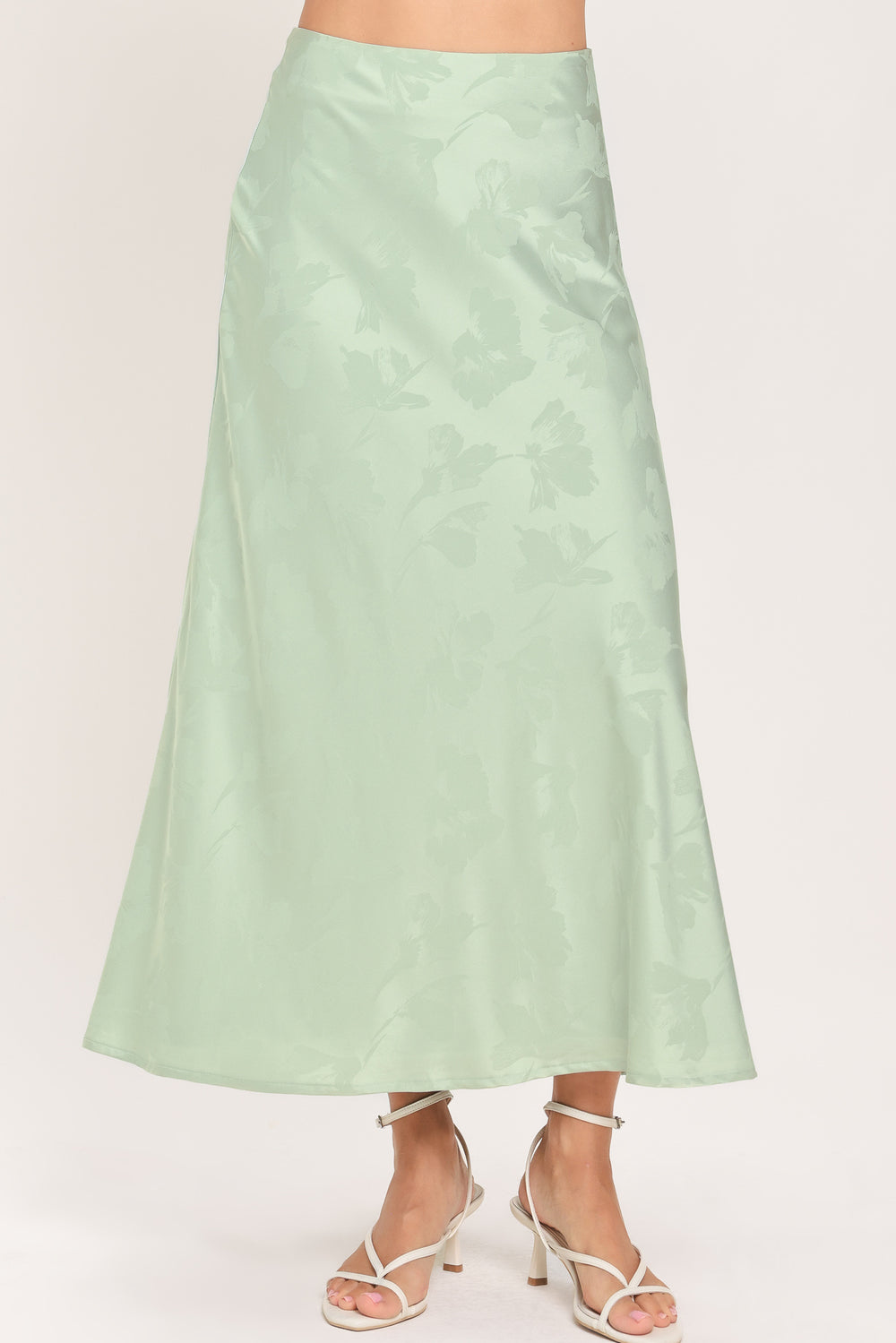 Woman wearing a high waisted jacquard satin midi skirt | Flying Tomato
