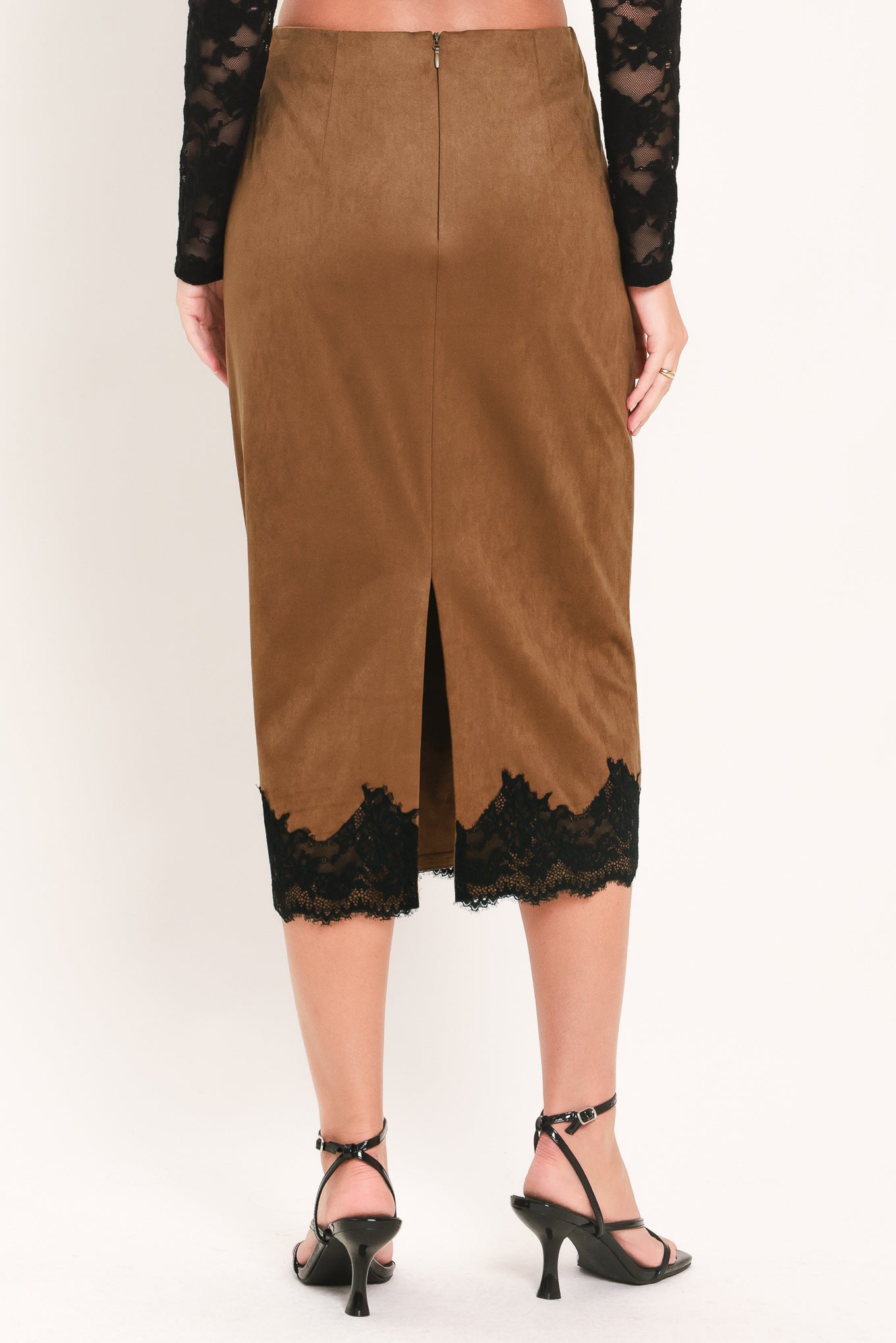 Woman wearing a brown faux suede pencil midi skirt with black lace trim at the bottom| Flying Tomato