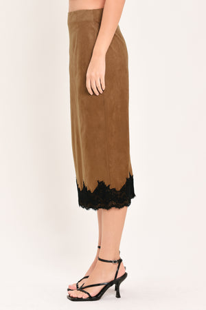 Woman wearing a brown faux suede pencil midi skirt with black lace trim at the bottom| Flying Tomato