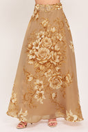A floor-length beige skirt with a large gold and cream floral rose pattern, featuring a matching beaded belt, shown on a model | Flying Tomato