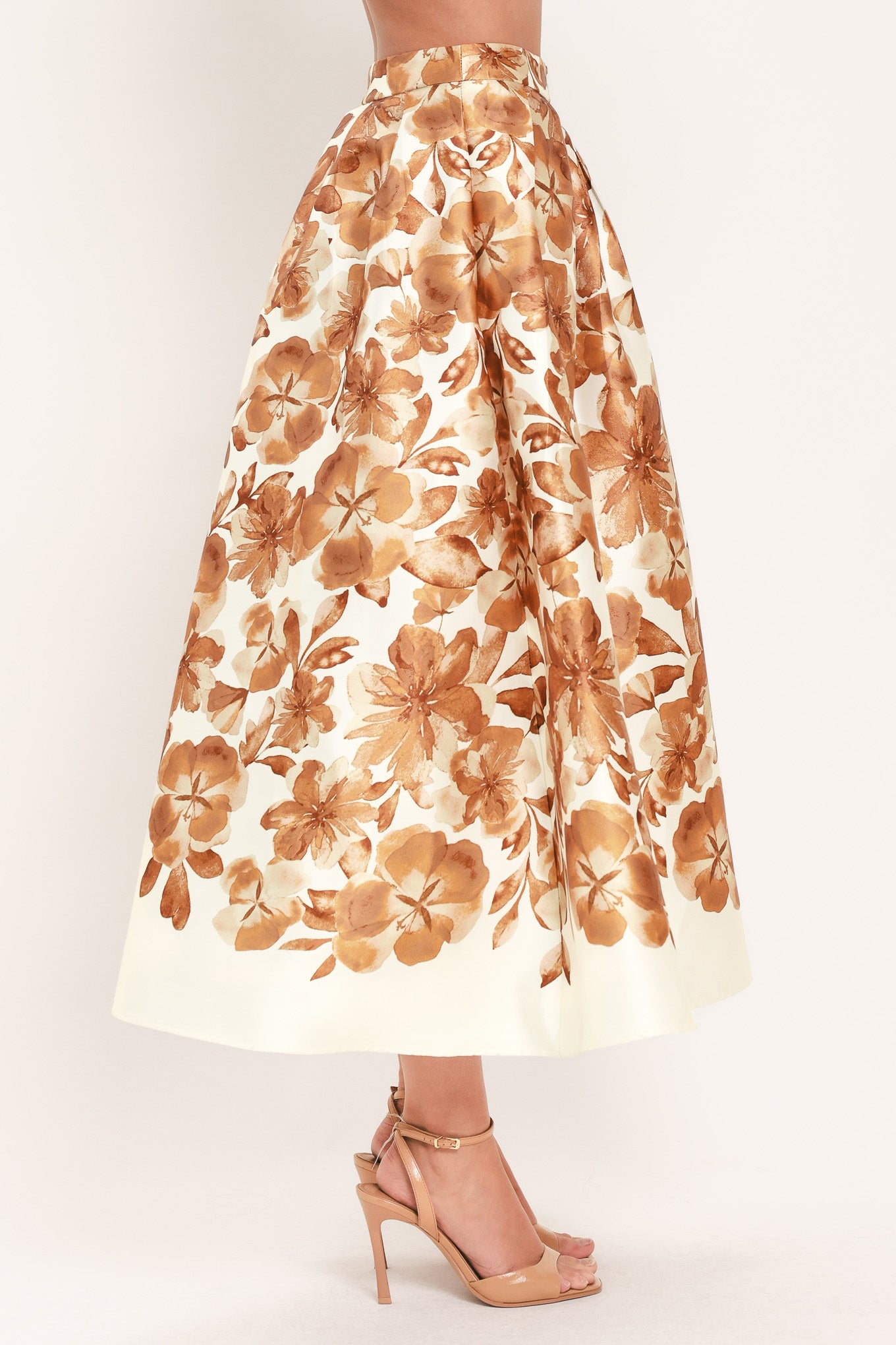 A high-waisted A-line midi skirt with a brown floral print | Flying Tomato